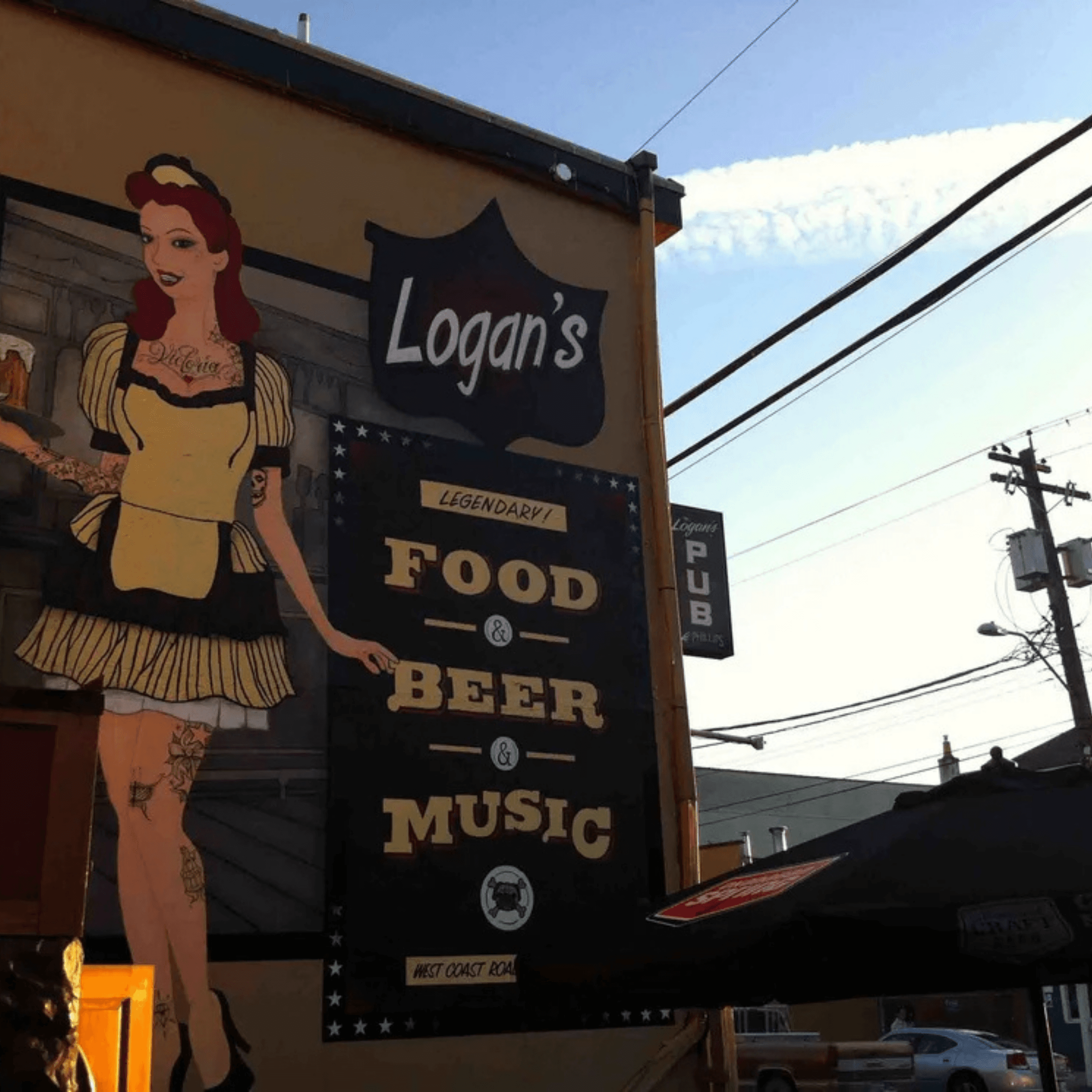 The painted mural outside Logan's Pub advertising food, beer and music